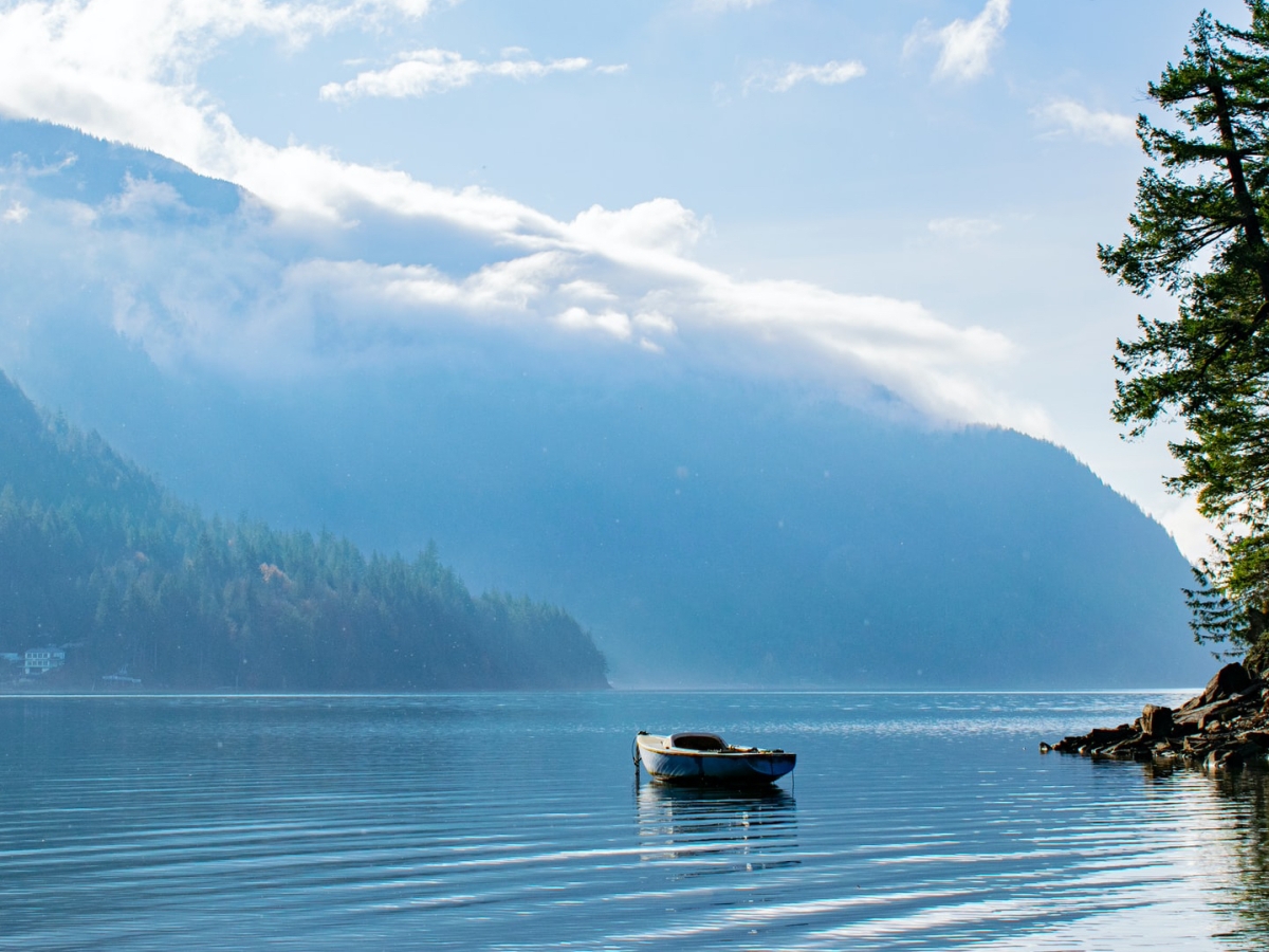 An empty row boat sits on Harrison Lake in British Columbia.